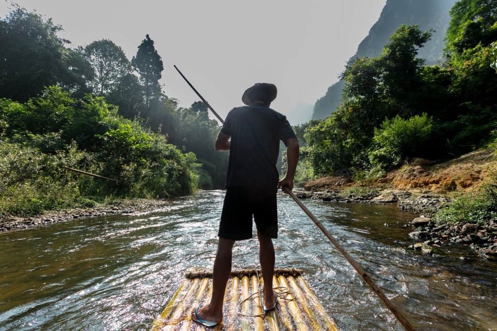 A traditional Bamboo raft powered by the arms and legs of Khao Sok locals, on one of the many rivers in this region