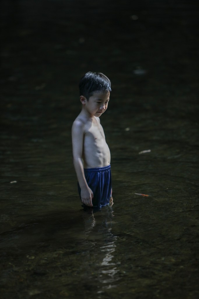 Solitary Child Standing Almost Perfectly Still, Khlong Sok River 